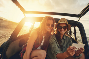 Women friends, selfie and car on vacation, beach and sunset on social media app with smile by...