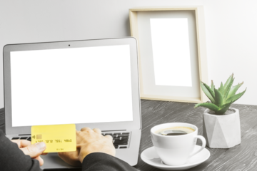 people sits on a work with a laptop computer for a wood table on the blackboard background