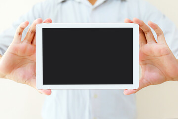 Hand holding blank screen phone or smartphone or tablet for template on white background.