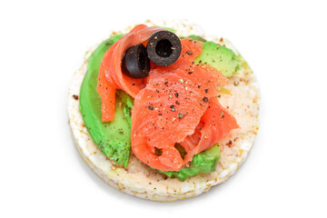 Rice Cake Sandwich with Fresh Salmon, Avocado and Olives - Isolated on White. Easy Breakfast. Diet Food. Quick and Healthy Sandwiches. Crispbread with Tasty Filling. Healthy Dietary Snack - Isolation