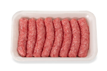 Raw turkey and pork meat sausage in food plastic tray for sale in supermarket, isolated on white...