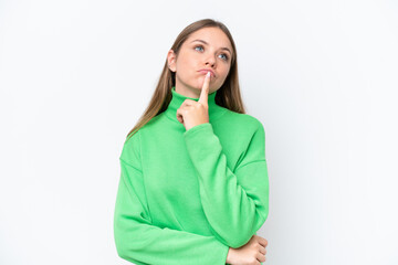 Young beautiful blonde woman isolated on white background having doubts while looking up