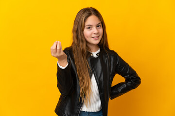 Child over isolated yellow background making Italian gesture