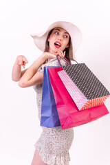 Caucasian woman holding shopping bags on white background with copyspace, sales concept