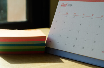 Calendar for the month of April of the year 2023 with block of colored notes. Organization and...