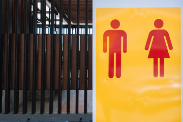 Red yellow modern men and women public toilet or restroom sign with copy space