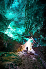 Colorful green glow highlights the ice caves in Iceland