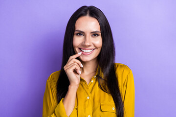 Portrait of lovely creative minded lady beaming smile finger touch lip isolated on purple color...