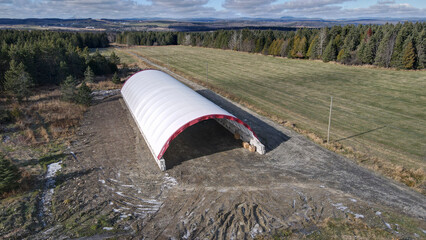 Aerial view of the construction of a fabric dome building.  Fabric structure. Hoop building. Canvas structure. Storage. Agricultural storage. Prefabricated. Commercial dome. Agriculture. Dome storage.