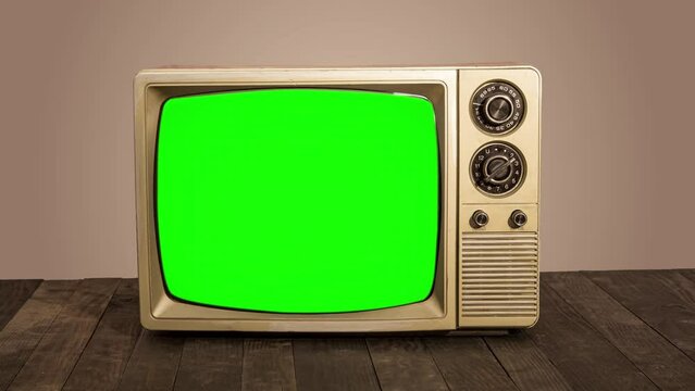 Vintage television with green screen inside copy space for your content.