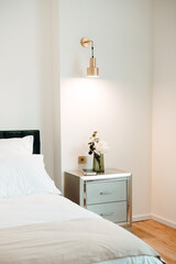 Details - Beautiful nightstand in elegant and comfortable modern bedroom. Interior design details