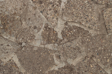 Close-up top view of a cobblestone road. Road texture