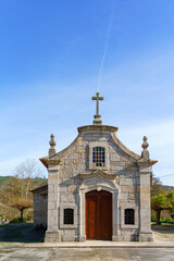 Fototapeta na wymiar entrance facade of an old catholic christian church