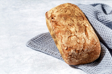 Dark bread on a gray napkin