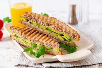 Vegan sandwich with cheese and avocado. Vegetarian breakfast.