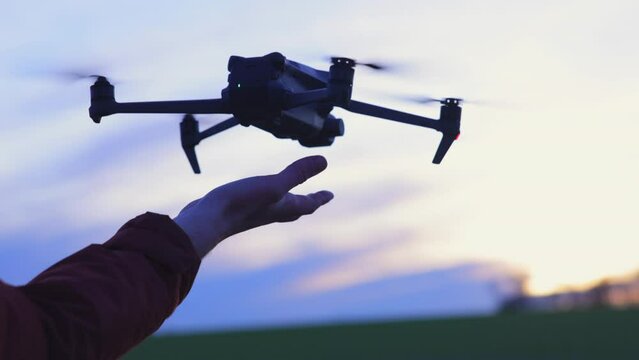 Aerial Drone Lands on the Palm of a Hand