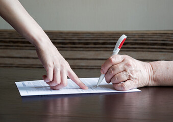 An old woman is forced to write a will for an apartment