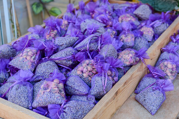 fragrant dry lavender flowers in fabric bags for sale in the market.