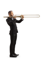 Full length profile shot of an elegant male musician playing a trombone