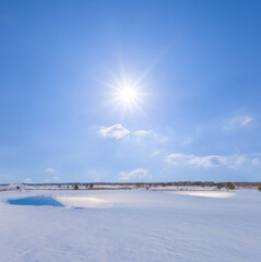 winter snowbound plain at sunny winter day