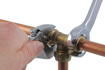 A pair of wrenches being used to adjust a compression tee fitting transparent png