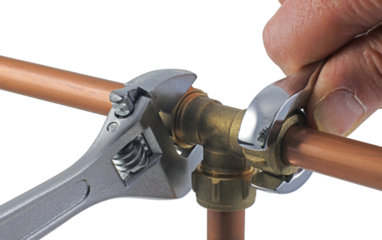 A pair of wrenches being used to adjust a compression tee fitting transparent png