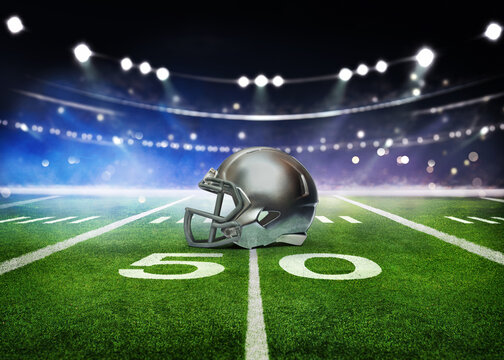 green field in american football stadium. ready for game in the midfield