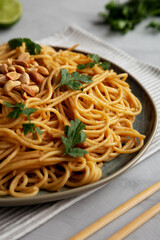 Homemade Asian Peanut Sauce Noodles on a Plate, side view. Close-up.