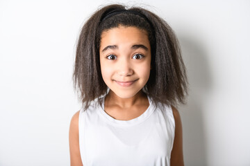 Adorable 9 years child girl on studio white background