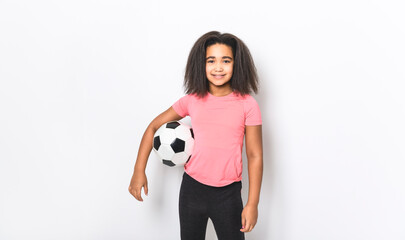 Little cute girl holding soccer ball isolated