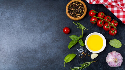 Obraz na płótnie Canvas Food background from vegetable, spices, herb on black table