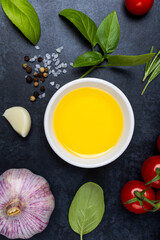 Food background from vegetable, spices, herb on black table