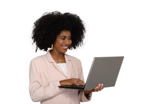 young woman typing on laptop computer keyboard looks at screen and smiles, black woman