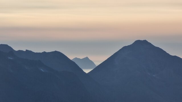 Beautiful Foggy Mountain Range On Kvaløya At Sunset, Tromsø, Norway