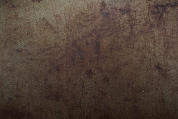 Dark abstract background with scuffs and scratches. Metal texture with rust