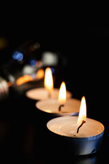 Electric lamp and candle on a dark background. Incandescent lamp and candle. No or power outage....