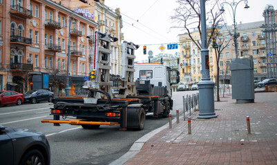 Fototapeta na wymiar towing truck car wrecker in city