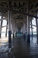 newport beach pier  famous tourist destination in orange county california with water waves and beach
