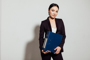 a business woman holds folders with documents in the office