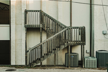 wooden staircase on the rear of a commercial building