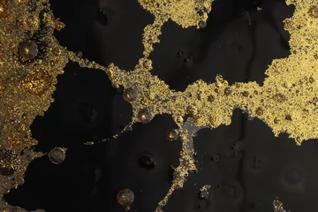 Rolgordijnen Flow pour oil and acrylic color painting blot. Abstract black and gold glitter texture background. © Liliia
