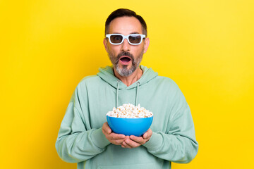 Photo of retired excited man brunet hair open mouth speechless hold popcorn stunned incredible...
