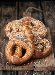 Freshly baked homemade  pretzel with salt, sesame and poppy seeds