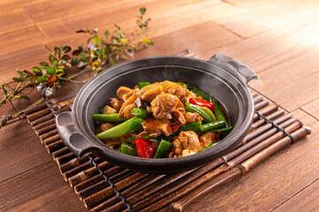 Spicy Casserole ginger chicken served dish isolated on wooden table top view of Hong Kong food