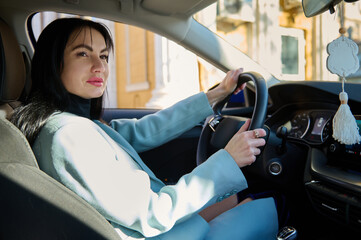 Portrait of happy female driver, beautiful confident middle-aged Caucasian woman, businesswoman,...