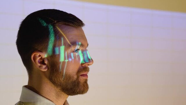 Confident professional businessman looking in camera with stock trade or cryptocurrency graph in background