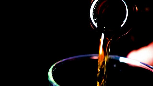 Pouring wine, pouring wine from a bottle, macro photography