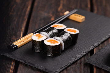 Maki sushi rolls with smoked salmon - Sushi menu. Japanese food concept