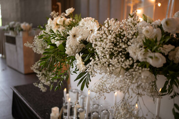 Main table at a wedding reception with beautiful fresh flowers. Wedding day.