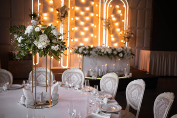 Luxury wedding table setting with flower centerpieces and candles